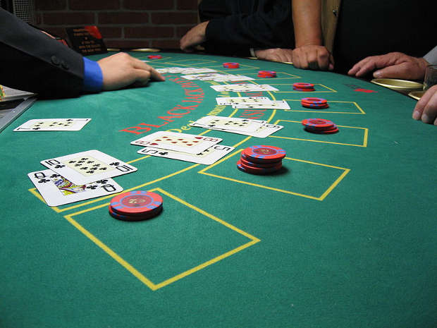 Gamblers playing blackjack.