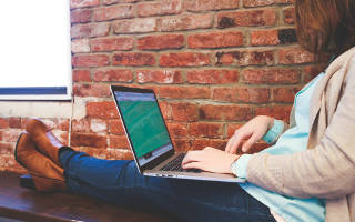 Women using a laptop to gamble online.